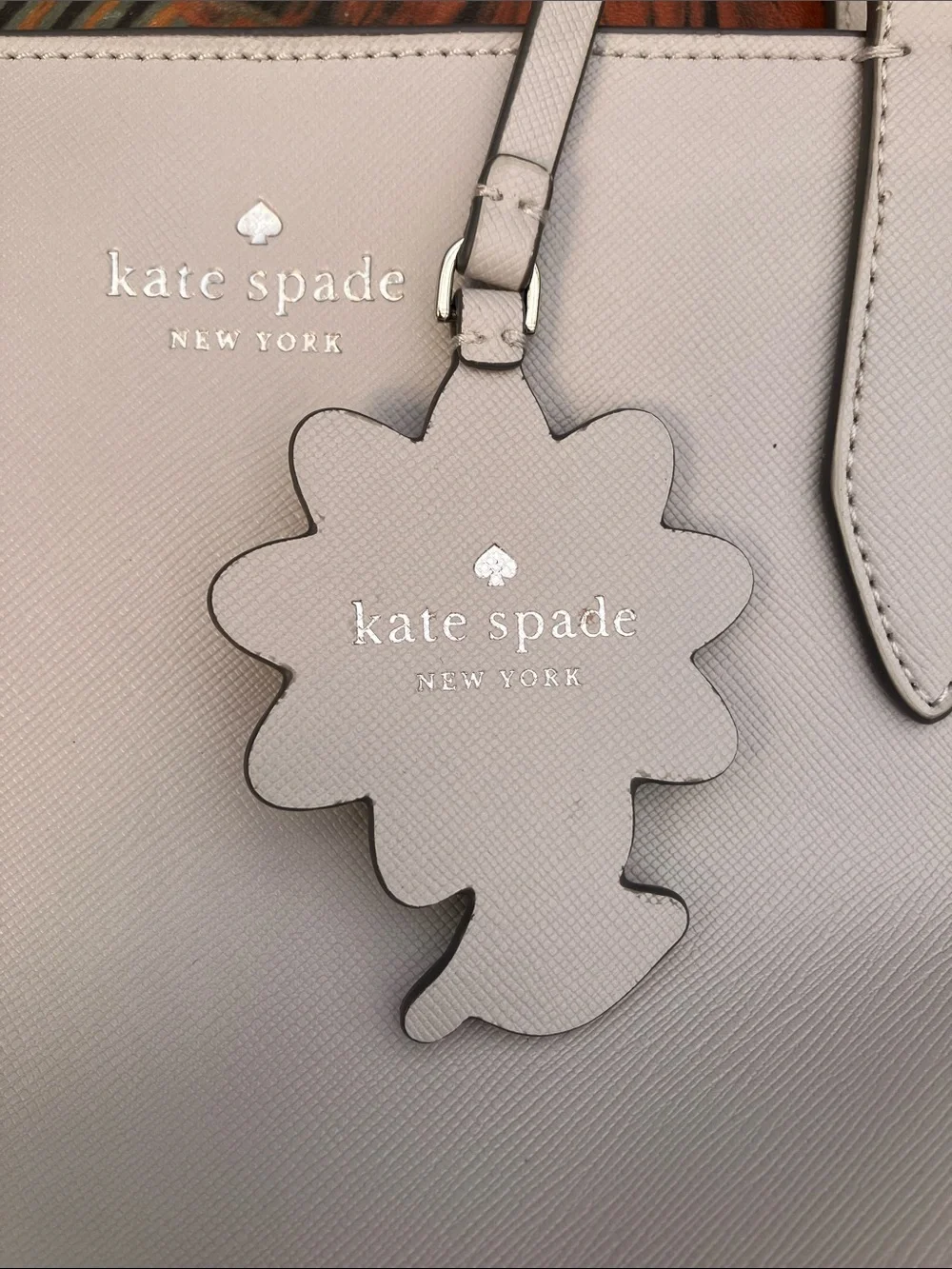 kate spade light gray Dana leather tote with daisy charm